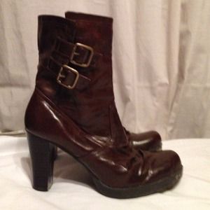 Brown ankle boots with buckles.