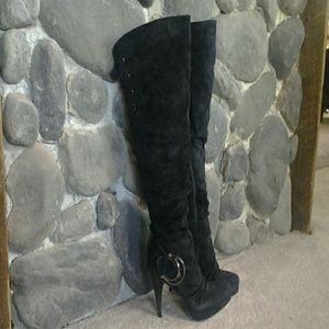 Black leather thigh high boots