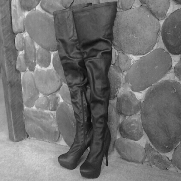 Thigh high black leather boots