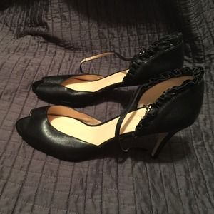 Sassy black heels with ruffle around ankle