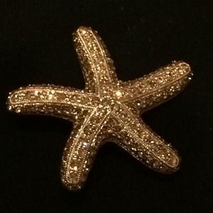 Glittering gold starfish pin