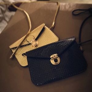 Gold and black cross bodies