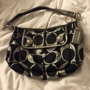 Authentic Coach with Silver Lettering.