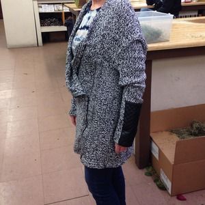 Sweater and sheer blouse both holding for purchase