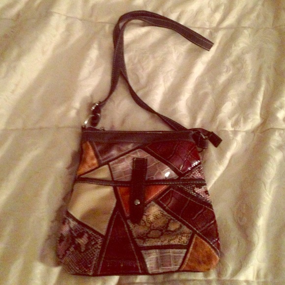 Sold.Great little cross-body purse.