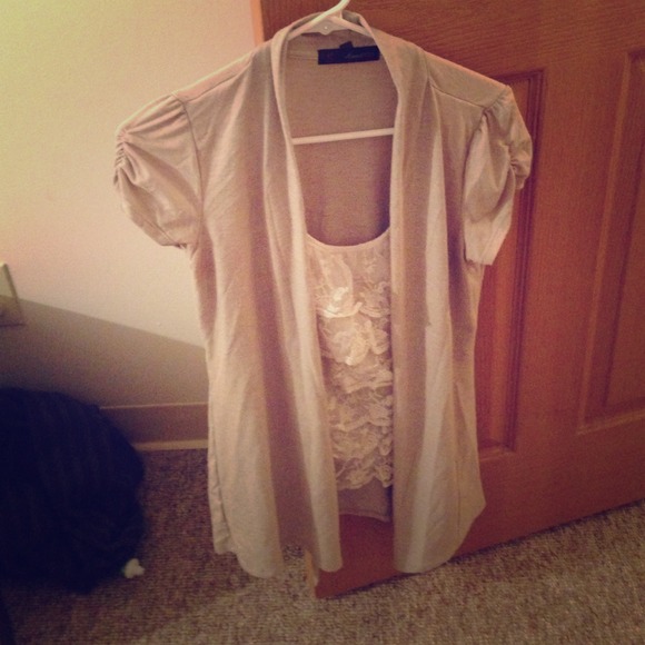 Grey sweater attached with a lace undershirt.