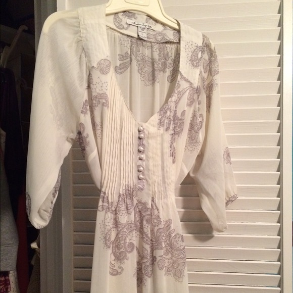 Sheer cream top with black details