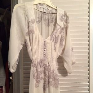 Sheer cream top with black details