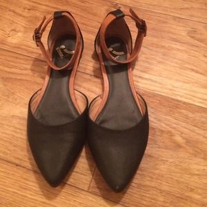Pointed toe ballet flats with ankle straps.