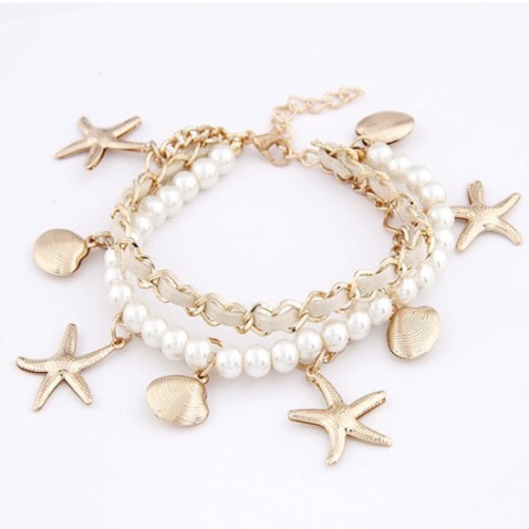 Jewelry - Nautical bracelet with golden seashells charms