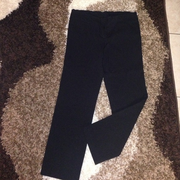 Black slacks & black - cream pumps.