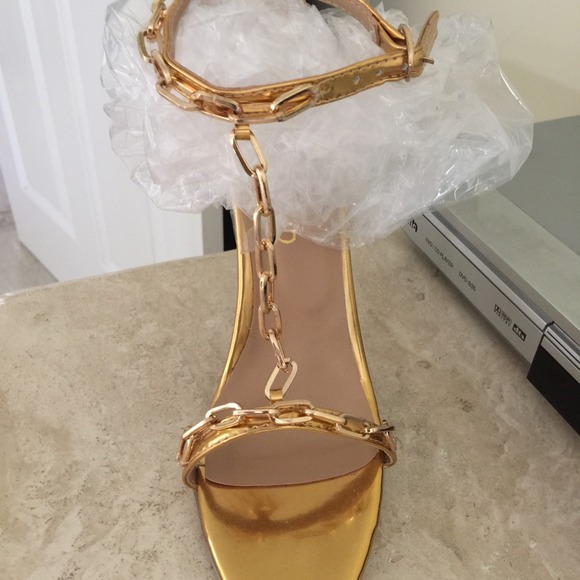 Women's gold chain high heel shoes.