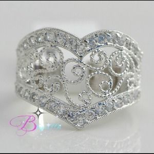 Almost diamonds heart shaped filigree band