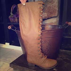 Knee high brown leather boots.