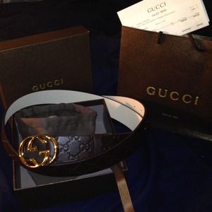 Gucci belt G logo around belt