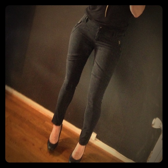 Black moto style skinny pants with cool leg detail