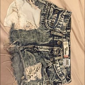 destroyed blue denim shorts