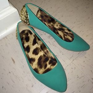 Green flats with gold stud backs