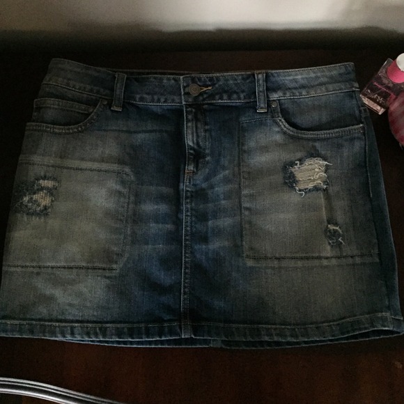 Adorable Distressed blue jean skirt.