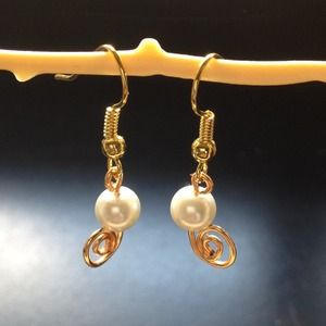Faux pearl with gold plated wire detail. Handmade