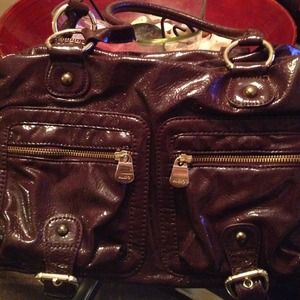 Also deep purple and gold patent leather purse