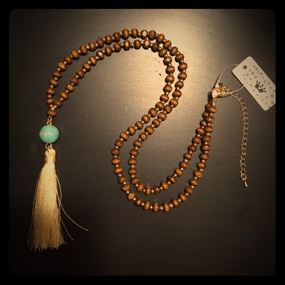 A bundle of Wooden beads and layered bracelet.