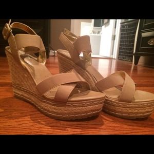 Tan strappy wedges.