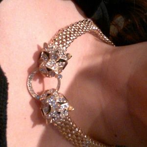 Gold tone panther statement necklace