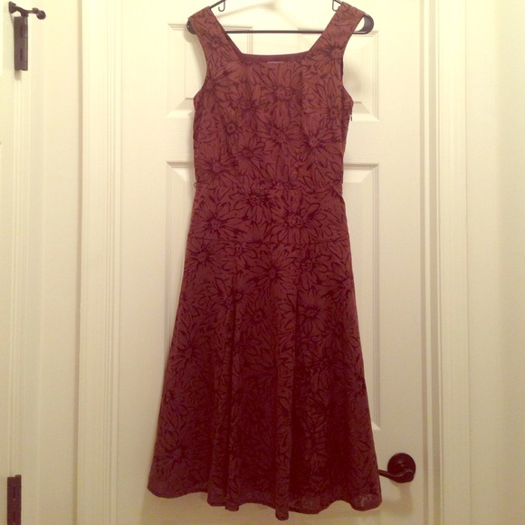 Classic brown dress with flower outline pattern.