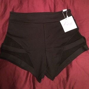 High waisted, black and sheer shorts.