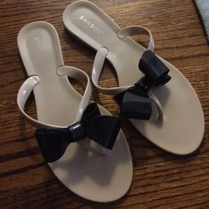 Nude with black bow jelly sandal