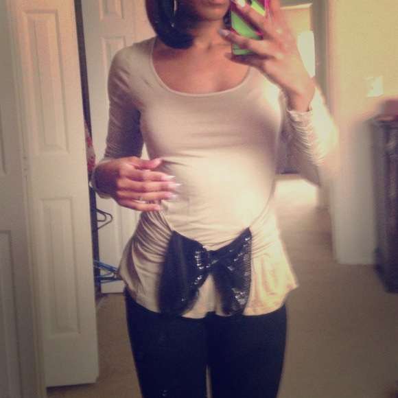 Tan long sleeve prissy shirt.