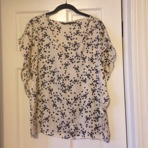 Zara blouse with black star pattern.