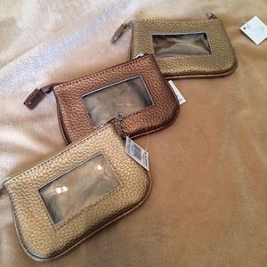 Bundled MSC small wallets in bronze and copper