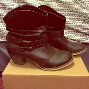 Brown cowgirl style booties with a heel