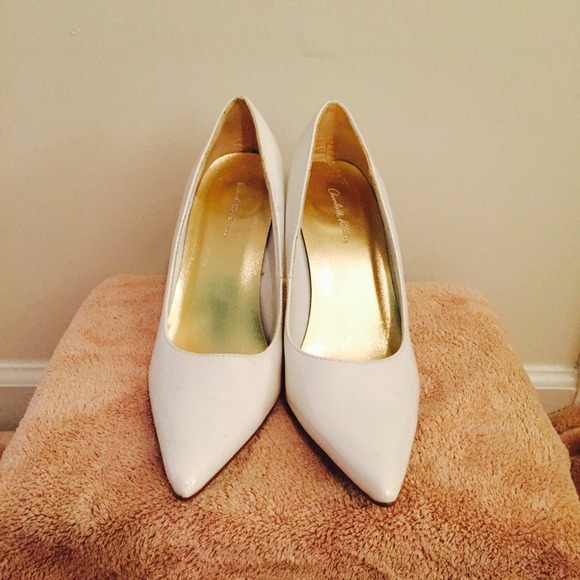 White patent leather pumps