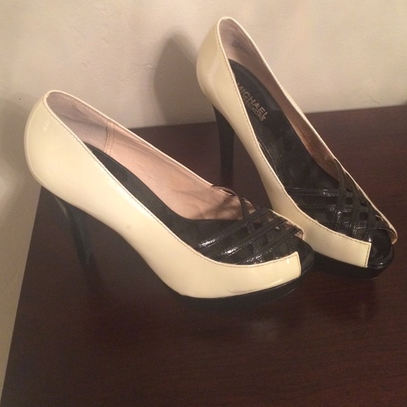 Never worn black and white Michael Kors pumps