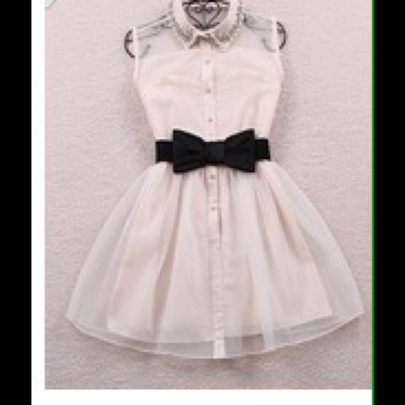 White sleeveless summer dress with a bow