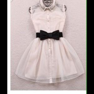 White sleeveless summer dress with a bow