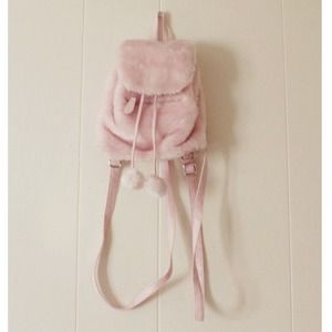 H e l d : faux fur fluffy pink mini backpack