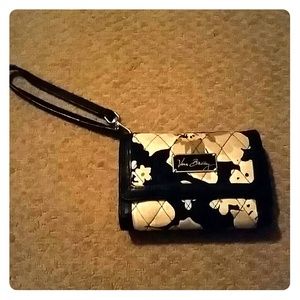 Small wristlet wallet with area to hold cell phone