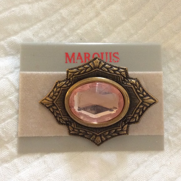 Art Deco style brass brooch with pink stone