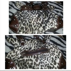 Cheetah purse with buckle . good condition