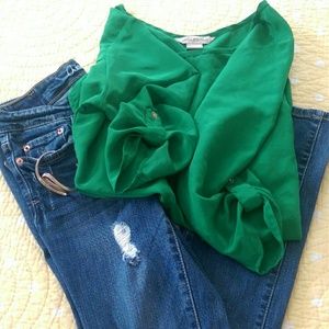 Distressed jeans and silk top