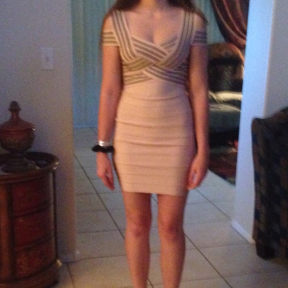 A pinkish nudeish bodycon bandage dress