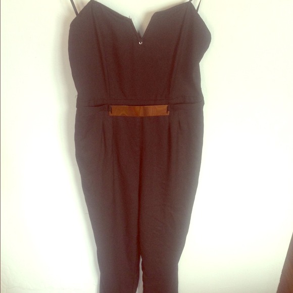 Black one piece jumpsuit with gold belt