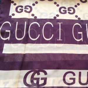 Two tone brown sheer scarf with the Gucci name.
