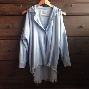 UNIF Light denim shirt with peek-a-boo shoulders.