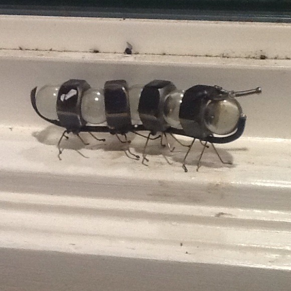 Handmade bolts and glass caterpillar