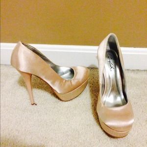 Pale pink Qupid heels with rhinestone detail.